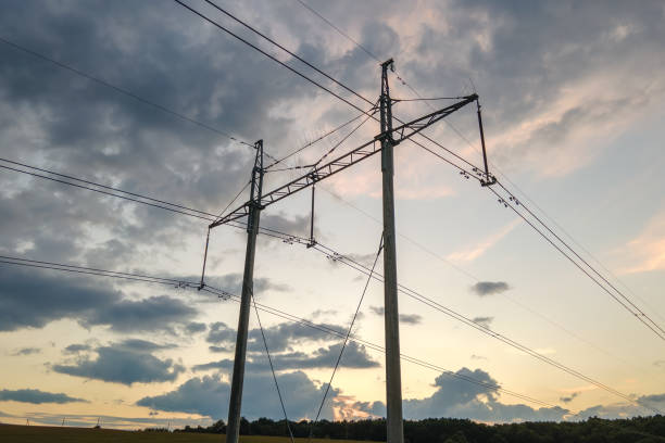 istock High voltage tower with electric power lines at sunset. 1358742250