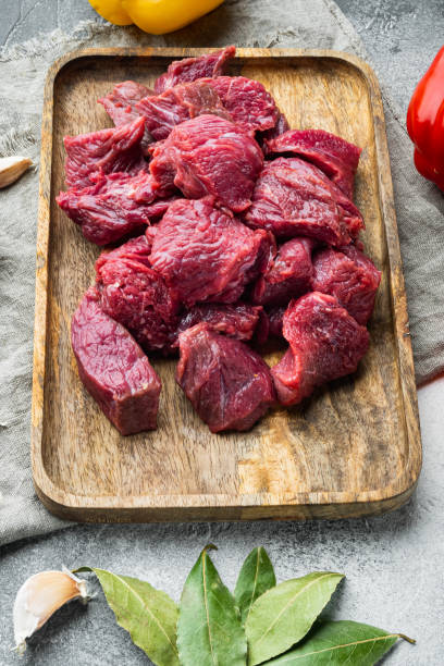 istock Raw organic meat  beef or lamb, on gray stone background 1358744965