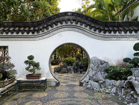 Archway of a Chinese Garden in Kowloon walled city park, Hong Kong, China.