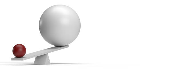 istock Small sphere stronger then big ball on seesaw 1358746186
