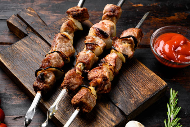 istock Healthy barbecued lean cubed pork kebab , on old dark  wooden table background 1358748015