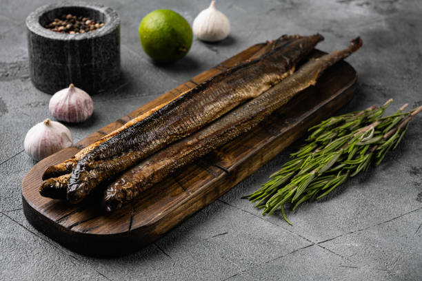 istock Smoked lamprey , on gray stone table background 1358748142