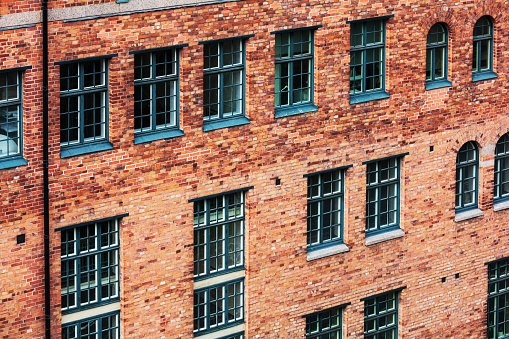 beautiful old brick office building with windows