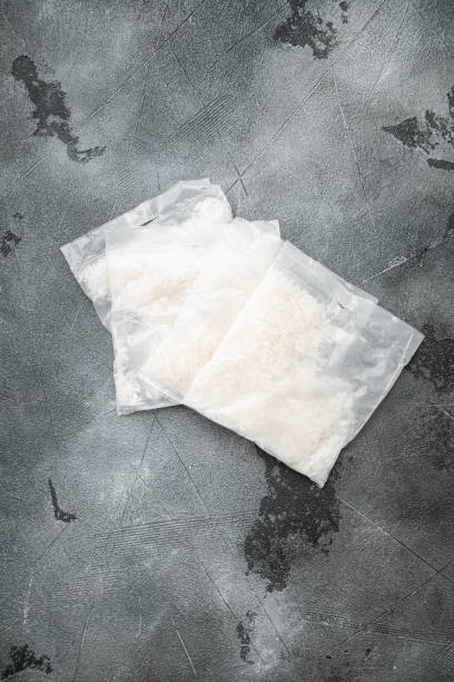 istock Rice basmati in portion bags, on gray stone table background, top view flat lay, with copy space for text 1358751786