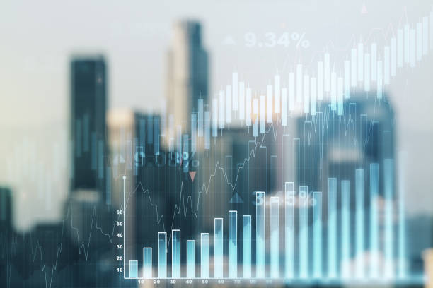 Multi exposure of virtual creative financial chart hologram on blurry cityscape background, research and analytics concept stock photo