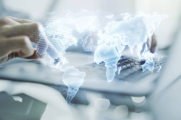 istock Multi exposure of abstract graphic world map and hands typing on computer keyboard on background, connection and communication concept 1358752746