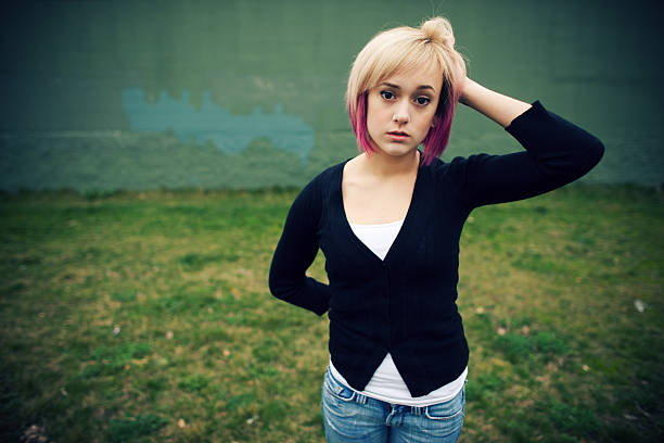 istock Sad Looking Female in the Grass 135875539