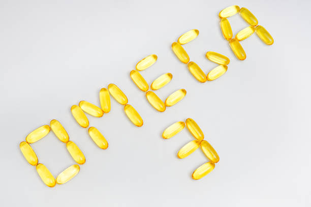 istock Text OMEGA 3 made from fish oil capsules on white 1358756119