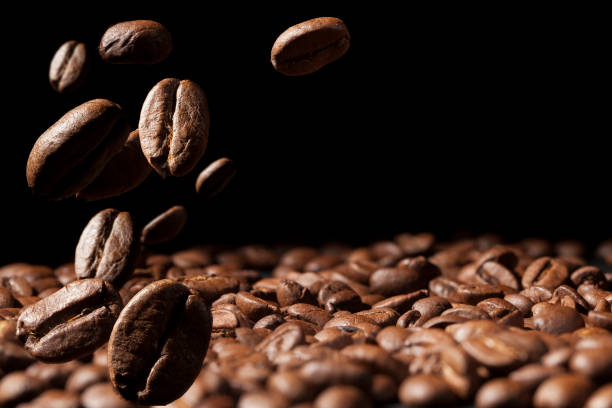 istock Beautiful background with coffee beans in dark colors 1358756853