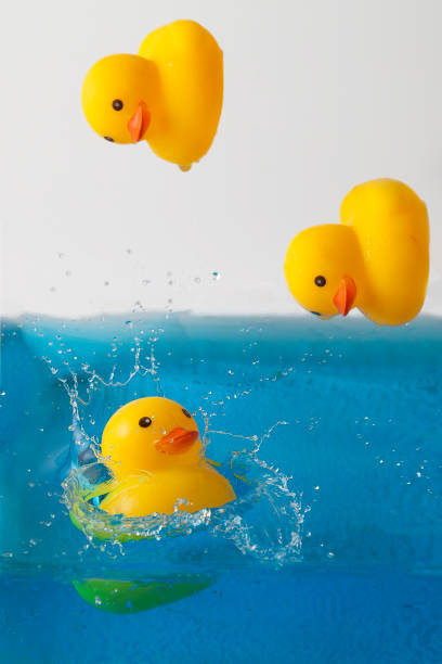 istock Yellow rubber ducks bathe, background for baby products for washing 1358757433
