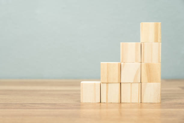 istock Growth step stairs arranged by wood cubes 1358758354
