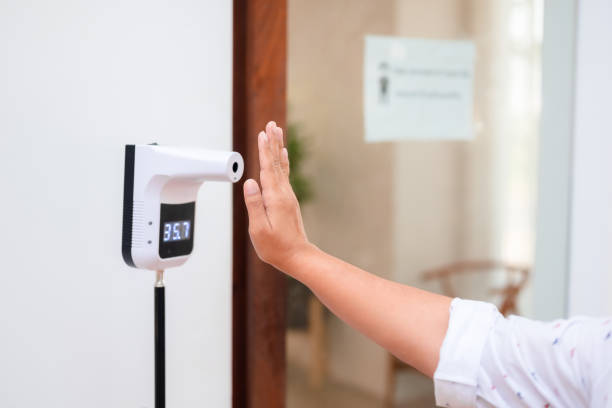 istock Checking the body heat at the temperature meter 1358758355