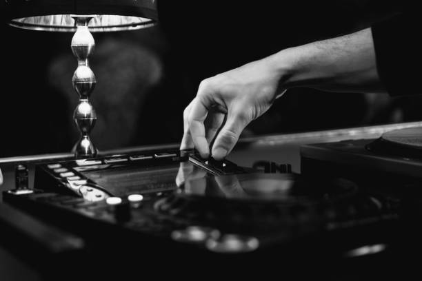 istock Close up view of the hand of a deejay during a performance 1358759917