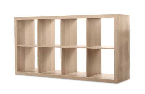 istock Empty wooden shelving unit for shoes isolated on white 1358760522