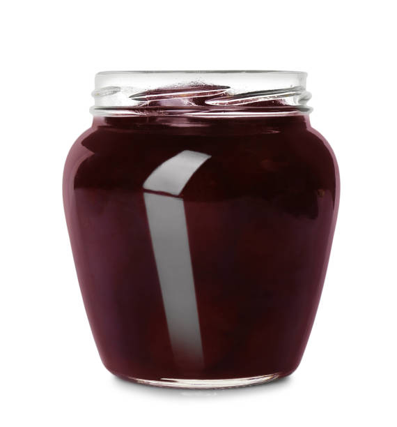 istock Jar of apple jam isolated on white 1358760595