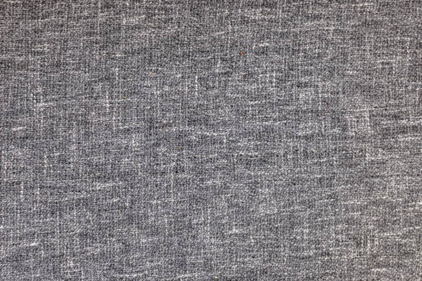 Close-up details textured shot of twisted white raffia cord basket weaving pattern background.
