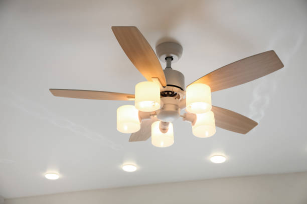istock Modern ceiling fan with lamps indoors. Interior element 1358762238