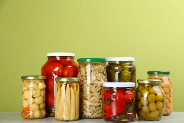istock Jars of pickled vegetables on light table 1358762563
