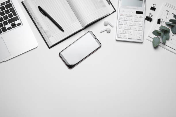 istock Laptop, smartphone and stationery on white background, flat lay. Space for text 1358763881