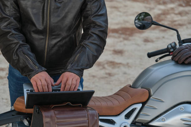 istock A digital nomad working on his laptop while traveling by motorcycle 1358764878