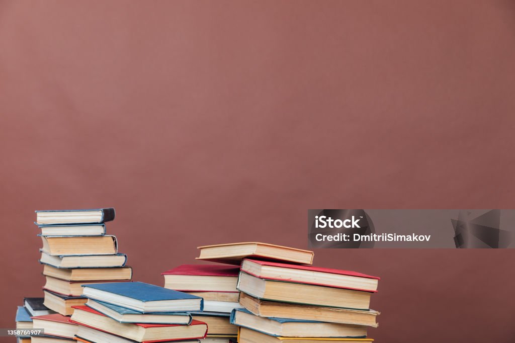 educational books for training in the college library on a brown background books for training in the college library on a brown background Dissertation Stock Photo