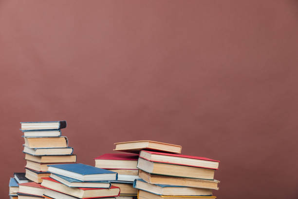 educational books for training in the college library on a brown background - retro revival brown paper messy imagens e fotografias de stock