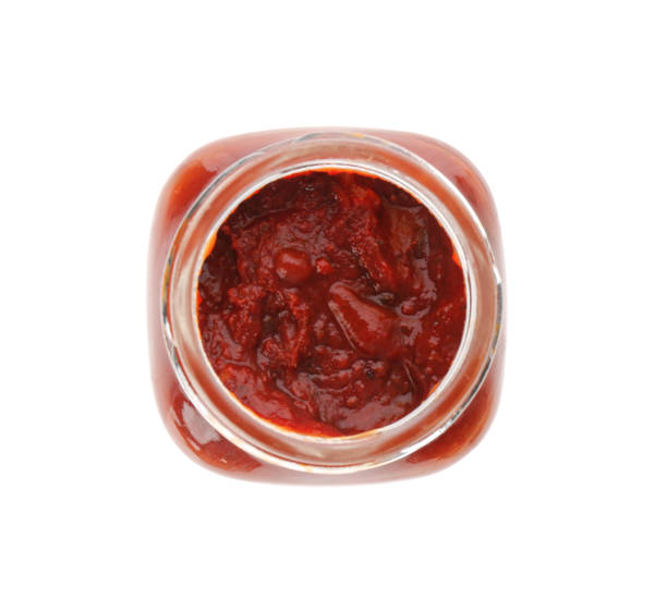 istock Jar of tomato paste isolated on white, top view 1358765411