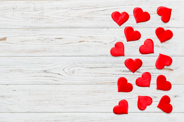 istock Valentine day background with red hearts, top view with copy space 1358765426