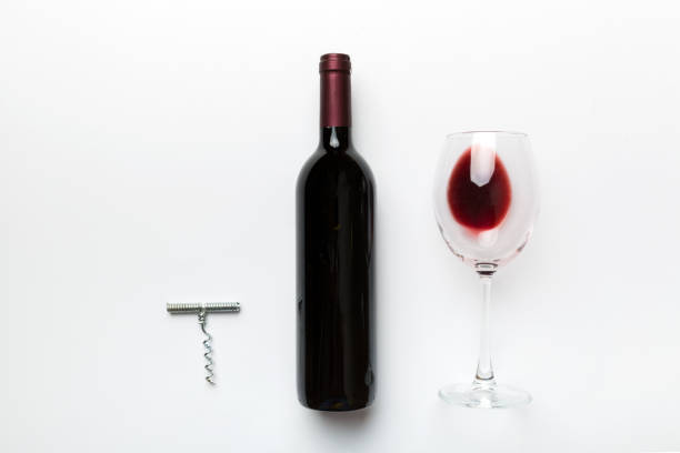 istock Flat lay composition with corkscrew, bottle of wine and elegant glass on colored table. Flat lay, top view wth copy space 1358765471