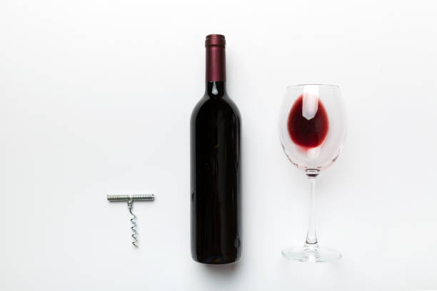 Flat lay composition with corkscrew, bottle of wine and elegant glass on colored table. Flat lay, top view wth copy space Flat lay composition with corkscrew, bottle of wine and elegant glass on colored table. Flat lay, top view wth copy space. drinks utensil stock pictures, royalty-free photos & images
