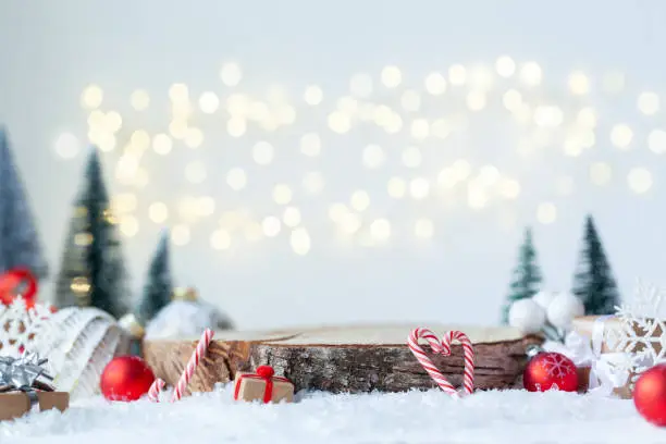 Photo of Christmas holiday mockup with wooden empty platform. Place for christmas product presentation