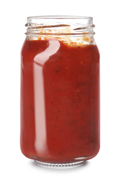 istock Jar of tomato paste isolated on white 1358768484