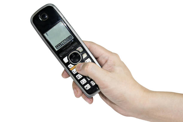 Hand holding old phone isolated on white background with clipping path.