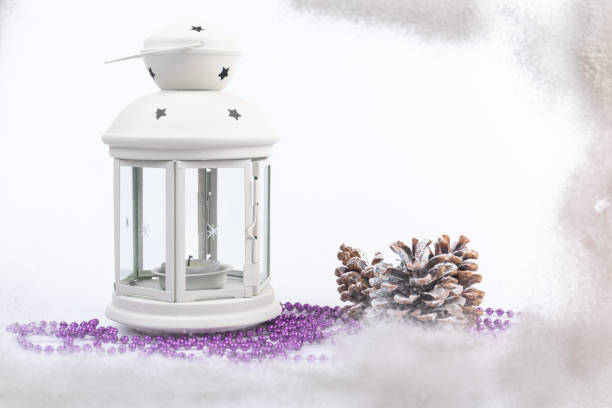 istock White lantern with candle inside and Christmas decoration on white background. Copy space. 1358772569