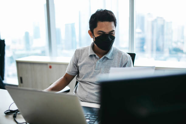 istock asian adult review document during working in the office 1358773772