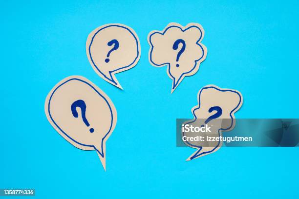 Questions In Speech Bubble Over Blue Background Stock Photo - Download Image Now - Ignorance, Question Mark, Advice