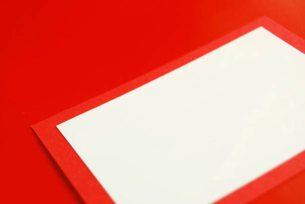 istock One white coloured empty blank gift card template with a red border placed on a red coloured backdrop 1358774436
