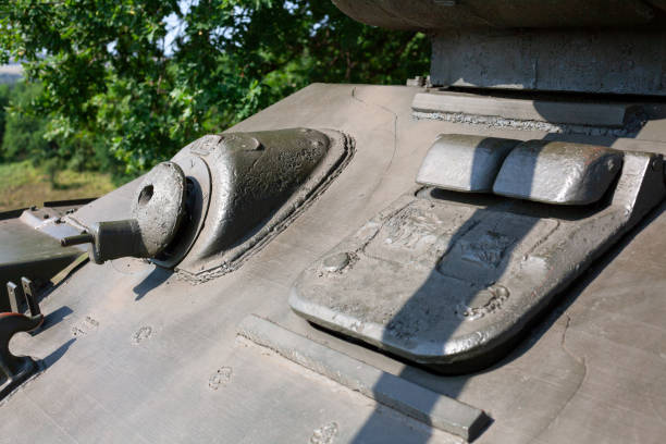 istock Close up of machine gun and metal hatch on soviet tank from Second World War II. Selective focus on machine gun 1358775109