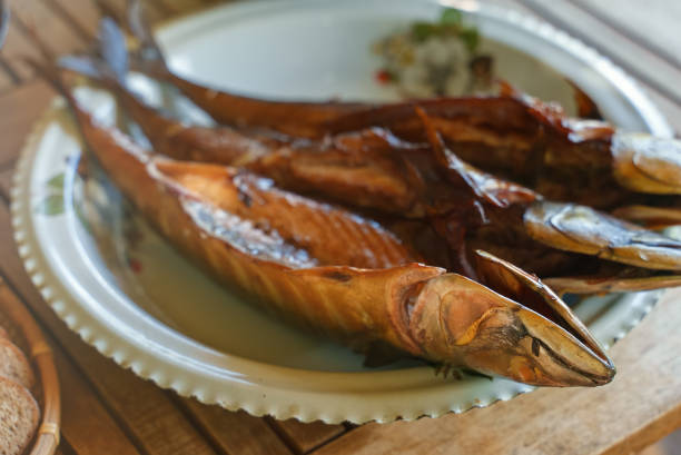 istock Fresh hot smoked mackerel on the table. 1358775506