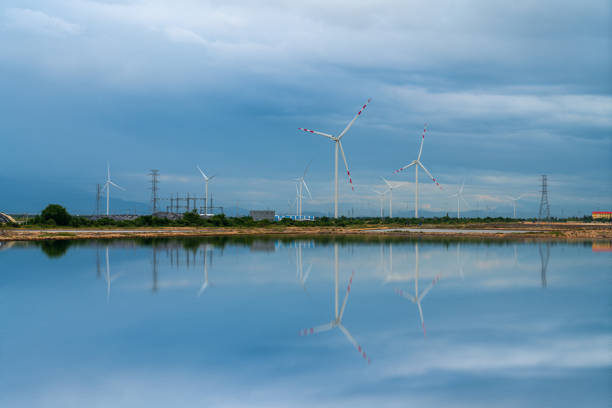 Wind turbines reflection by the lake Phan Rang, Ninh Thuan province, central Vietnam