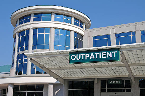 Hospital with Outpatient sign Outpatient Sign over a Hospital Outpatient Services Entrance entrance sign photos stock pictures, royalty-free photos & images