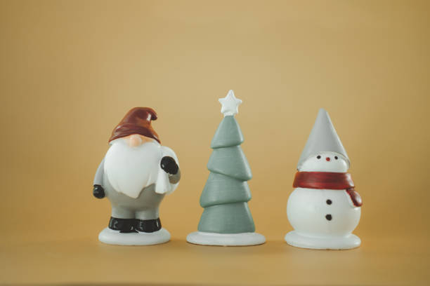 Christmas figurine against yellow background
