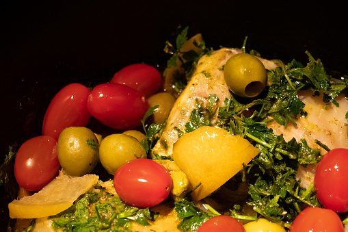 tajine, traditional oriental dish based on vegetables, chicken, olives and spices