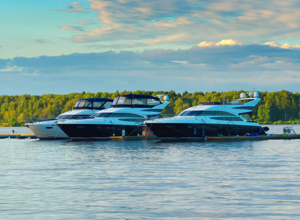 istock Multiple yacht boats at sunset river background 1358778014