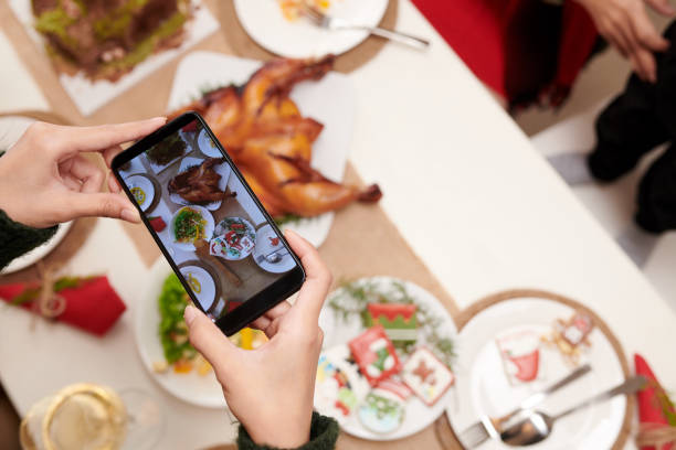 istock Person Photographing Christmas Dinner 1358779935
