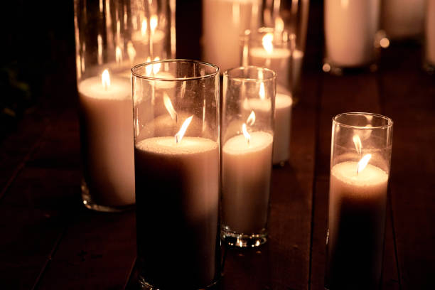 istock Night wedding ceremony decorations with candles in glass vases outdoors, copy space 1358780238