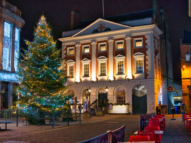 The Mansion House in York, Yorkshire, UK - the official residence of the Lord Mayor of York. Lit at night around Christmas with a large, lit Christmas tree in the foreground. The Mansion House in York, Yorkshire, UK - the official residence of the Lord Mayor of York. Lit at night around Christmas with a large, lit Christmas tree in the foreground. york yorkshire stock pictures, royalty-free photos & images