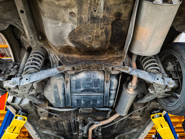 istock Lifting car engine and suspension system awaiting maintenance in garage 1358785185