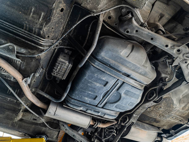istock Lifting car engine and suspension system awaiting maintenance in garage 1358785203