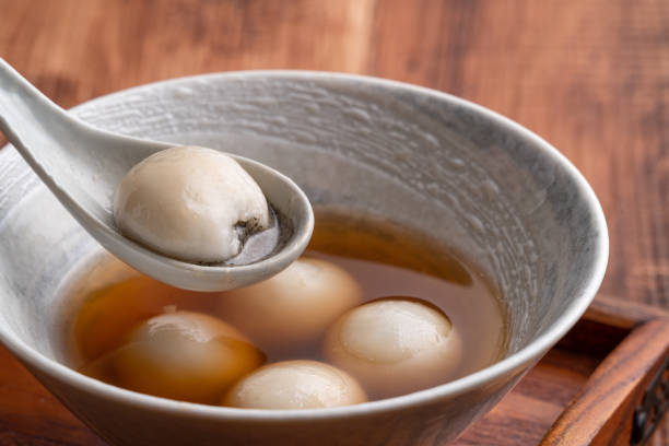 istock Sesame big tangyuan with syrup soup. 1358785528